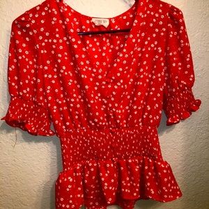 Cute red blouse with white flowers!